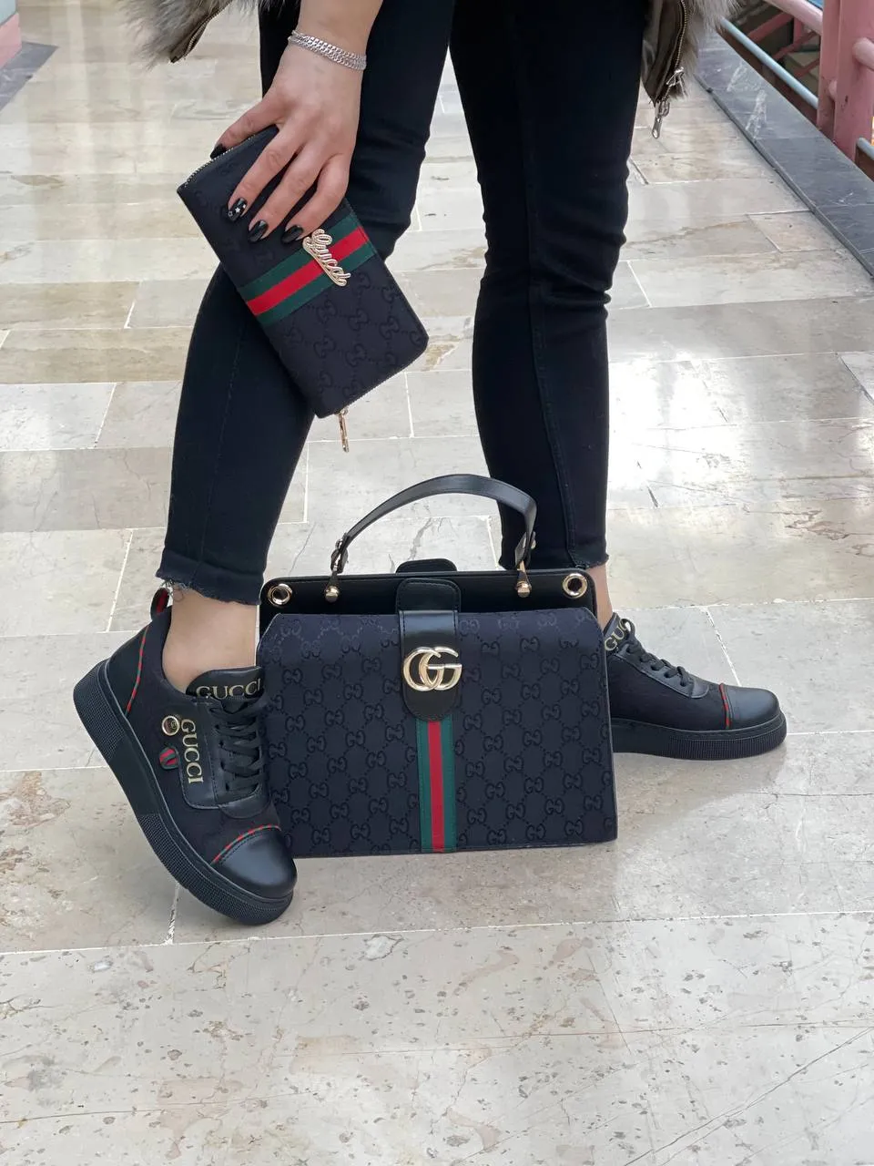 Black sneaker bag set with GG next to it